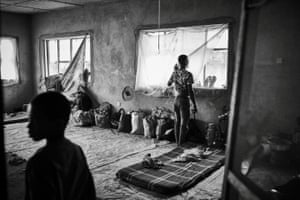 A man stands at a window in a local government building