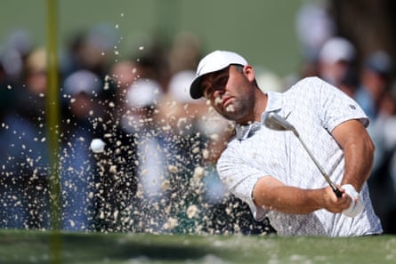 Scottie Scheffler plays out from the bunker