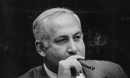 black and white picture of a man smoking a cigar