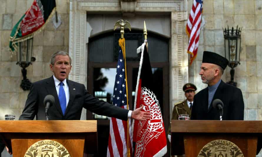 Presidents George W. Bush and Hamid Karzai at a press conference in Kabul on 1 March 2006.