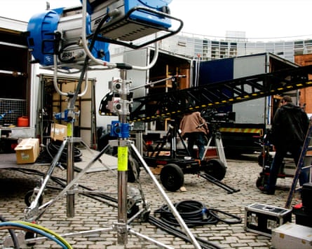A film set with film equipment and rigs/rigging and transport trucks in Smithfield Square Dublin, Ireland.
