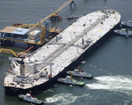 Oil prices fall below $100 a barrel on hopes of Iran peace deal