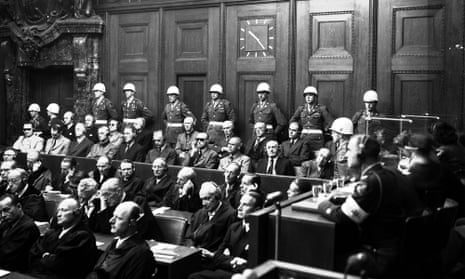 A general view in the Palace of Justice, Nuernberg, as defendants heard parts of the verdict read by the International Military Tribunal, Sep. 30, 1946. Hans Frank is in the front row, fourth from right.