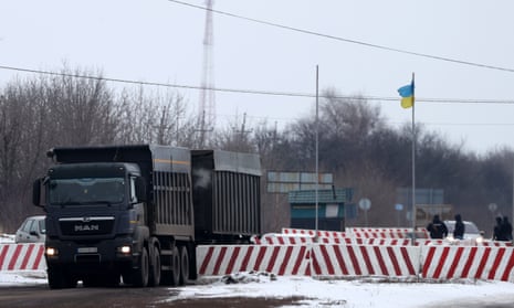 Members of the Ukrainian army inspect vehicles entering and leaving the city of Kostiantynivka