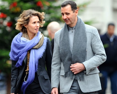 Asma and Bashar al-Assad walking in a street of Paris
