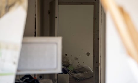Bullet holes are seen in the walls behind an open safe room door where days earlier an attack by Hamas militants took place on this kibbutz in Kfar Aza, Israel, near the border with Gaza