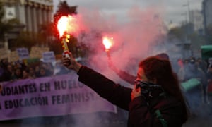 A woman burns a flare in Madrid. 4053.jpg?width=300&quality=85&auto=forma