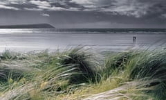 Wales, Pembrokeshire, two people walking on Pendine Sands,June 2003