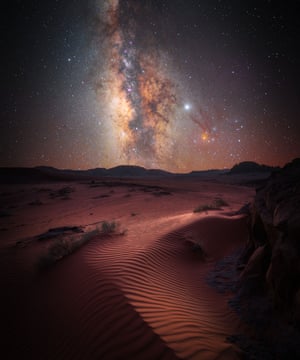 Skyscapes runner-up: Desert Magic by Stefan Leibermann (Germany) The photographer took this image during a trip through Jordan. He stayed for three days in the desert at Wadi Rum. The photographer tried to capture the amazing starry sky over the desert. He used a star tracker device to capture the image. Leibermann found this red dune as a foreground and snapped the imposing Milky Way centre in the sky