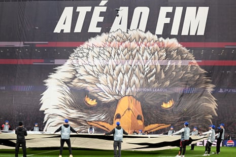 Benfica fans unveil a tifo featuring an image of a bald eagle prior to the Champions League knockout round play-off first leg football match between Benfica and Real Madrid.