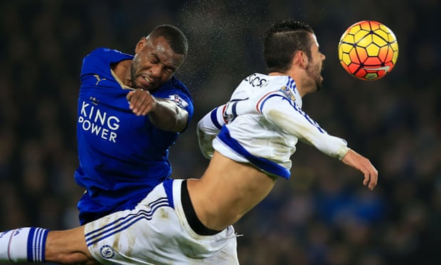 Leicester City’s Wes Morgan, left, and Chelsea’s Diego Costa battle for the ball in the game on Monday night.