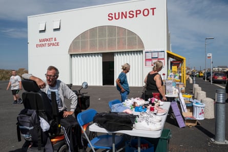 Robert in his wheelchair at his market stall outside the community centre Sunspot