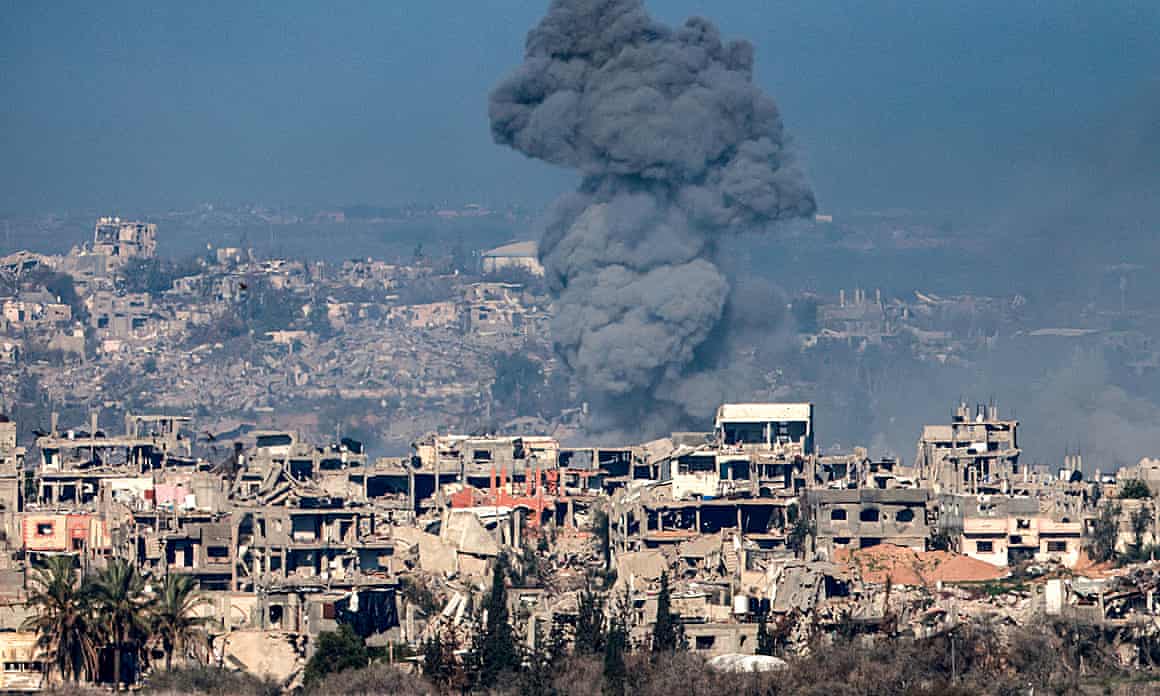 Smoke rises in Gaza, 13 January, as seen from Israel.