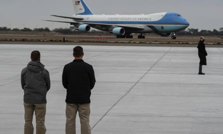 Members of Secret Service stand guard as Air Force One, with Trump aboard, lands at Valley international airport in January 2021.
