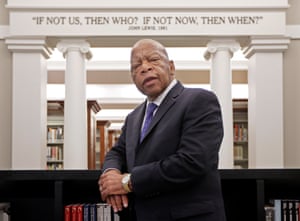 Lewis poses under a quote of his displayed in the Civil Rights Room in the Nashville Public Library in 2016, where he was awarded the Nashville Public Library Literary Award.