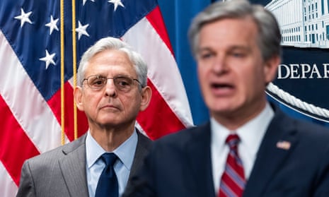 Merrick Garland with FBI chief Chris Wray. ‘This was an egregious attempt by PRC intelligence officers to shield a PRC-based company from accountability,’ Garland said.