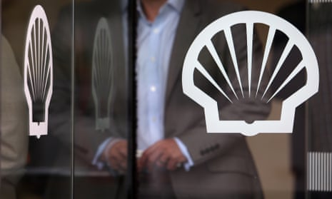 A person leaves Shell's London office