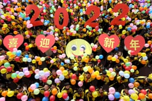 Zaozhuang, China. Students hold a 202’ sign and colourful balloons to welcome the new year.