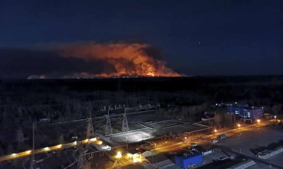 Wildfire at night in distance