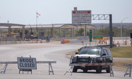 A Texas department of public safety highway patrol vehicle blocks the road leading to to the border crossing in Del Rio on 24 September.