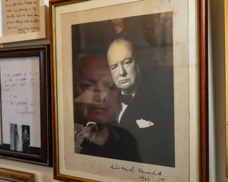 A photo of Andrew Broughton reflected in a signed photo of Winston Churchill.