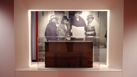 Wooden chest with large photograph behind