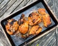 roast chicken pieces on an oven tray