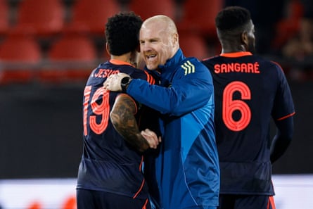 Dyche hugs Igor Jesus on the pitch at full-time after Forest’s away game against Utrecht in the Europa League.