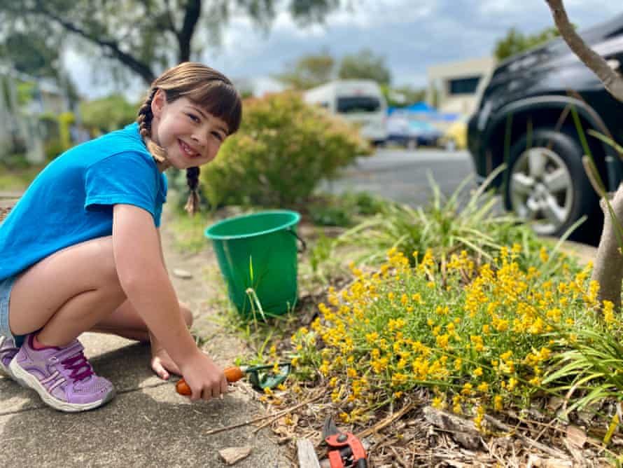Elsje Evans-Tracey (9) from Woolloongabba weeding in her native garden. Elsje applies the lessons learnt from her school environmental ed lessons to her home garden, with help from her mum Naomi Evans.