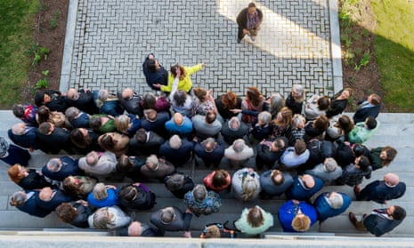 a view from above of a group of people standing outside a building