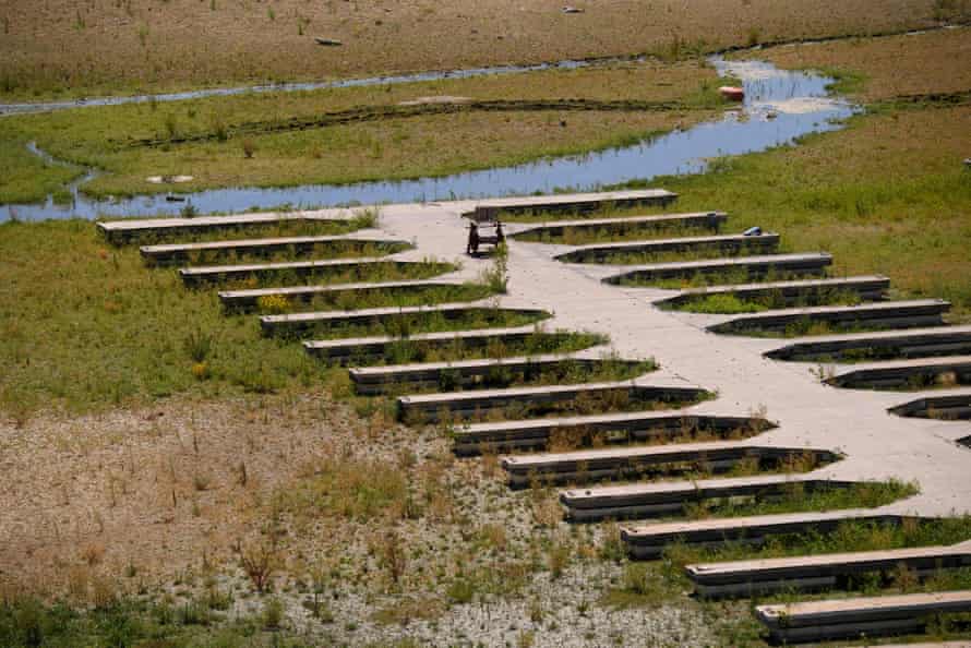 Empty boat slips sit on a dry lake bed at Folsom Lake Marina in May.