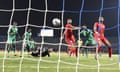 Tunisia’s Dylan Bronn (right) watches as his header flies into his own net