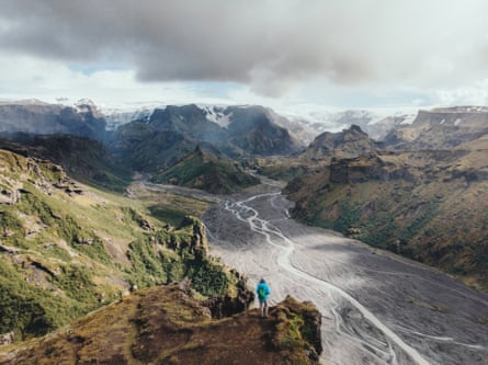 Aerial view of woman looking at Thórsmörk river valley, Iceland
