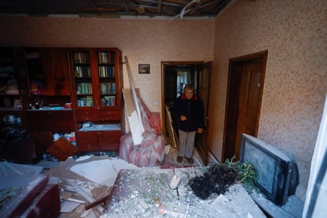 Liubov Fanta, 62, stands inside of her house damaged by a Russian missile attack in Mykolaiv.