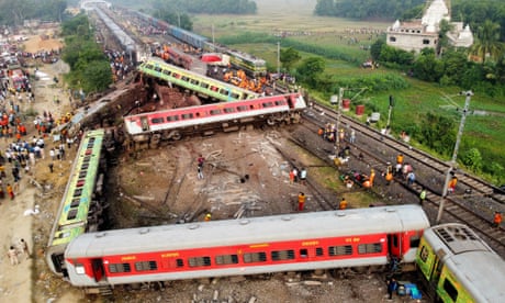 ‘Wailing for help’: passengers and bystanders tell of India train crash horror