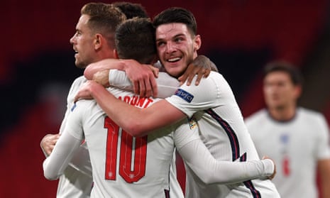 Declan Rice congratulates Mason Mount on his fellow midfielder’s winning goal for England against Belgium at Wembley.