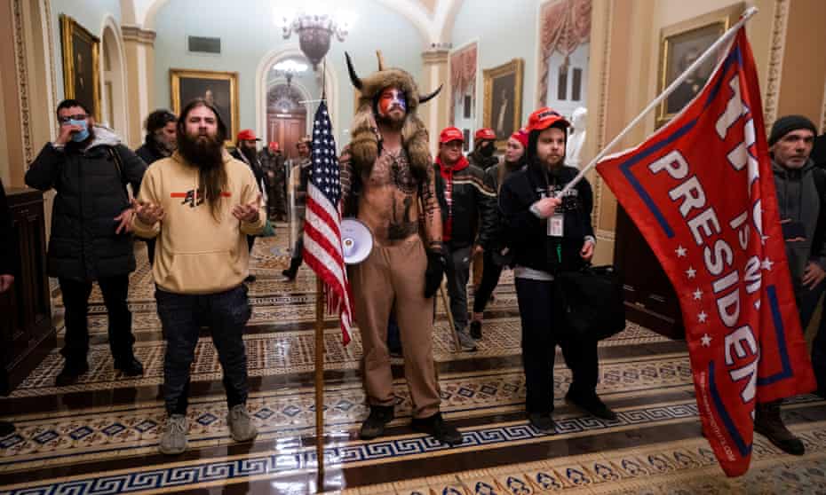 Trump supporters stand by the door to the Senate.