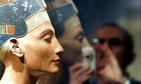 A visitor takes pictures of the bust of Egyptian queen Nefertiti in Berlin.