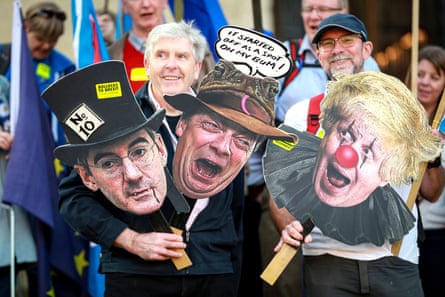 Remainers with placards showing Jacob Rees-Mogg and Boris Johnson (Eton) and Nigel Farage (Dulwich).