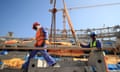 Construction workers work on the Lusail Stadium in Qatar