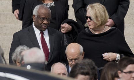 Justice Clarence Thomas, left, and his wife Virginia Thomas, right, are at the centre of ethical concerns surrounding the supreme court.