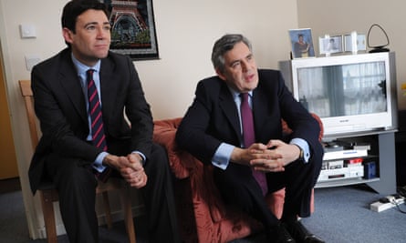 Burnham seated next to Brown during a visit to a voter’s house