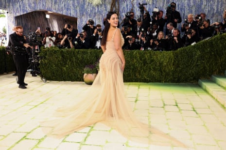woman in beige dresses poses