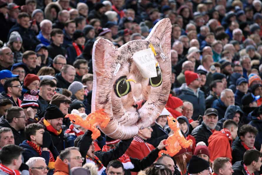 Liverpool fans hold up an inflatable cat to mock West Ham’s Kurt Zouma, as their team win the game 1-0