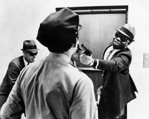 Kotto as one of the the bank robbers in the heist movie The Thomas Crown Affair, 1968