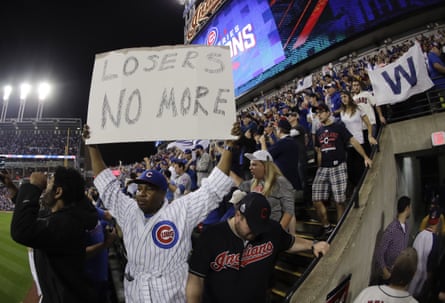 A fan react after the Cubs won Game 7.