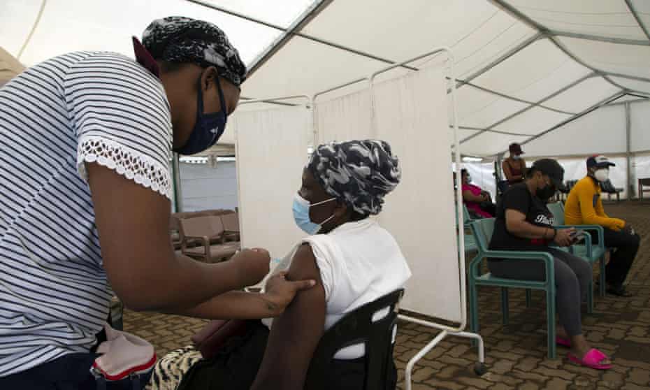 A woman receives a Covid vaccine dose at a centre in Soweto, South Africa