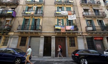 Banners against tourist apartments hang from balconies in Barcelona