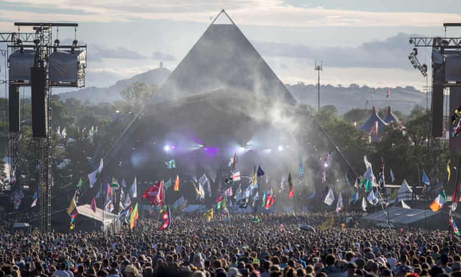 People gather in front of the Pyramid Stage at Worthy Farm in Pilton on 25 June 2017.