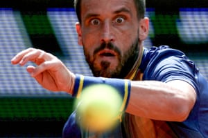 Damir Dzumhur eyes the ball as he plays against Giovanni Mpetshi Perricard.